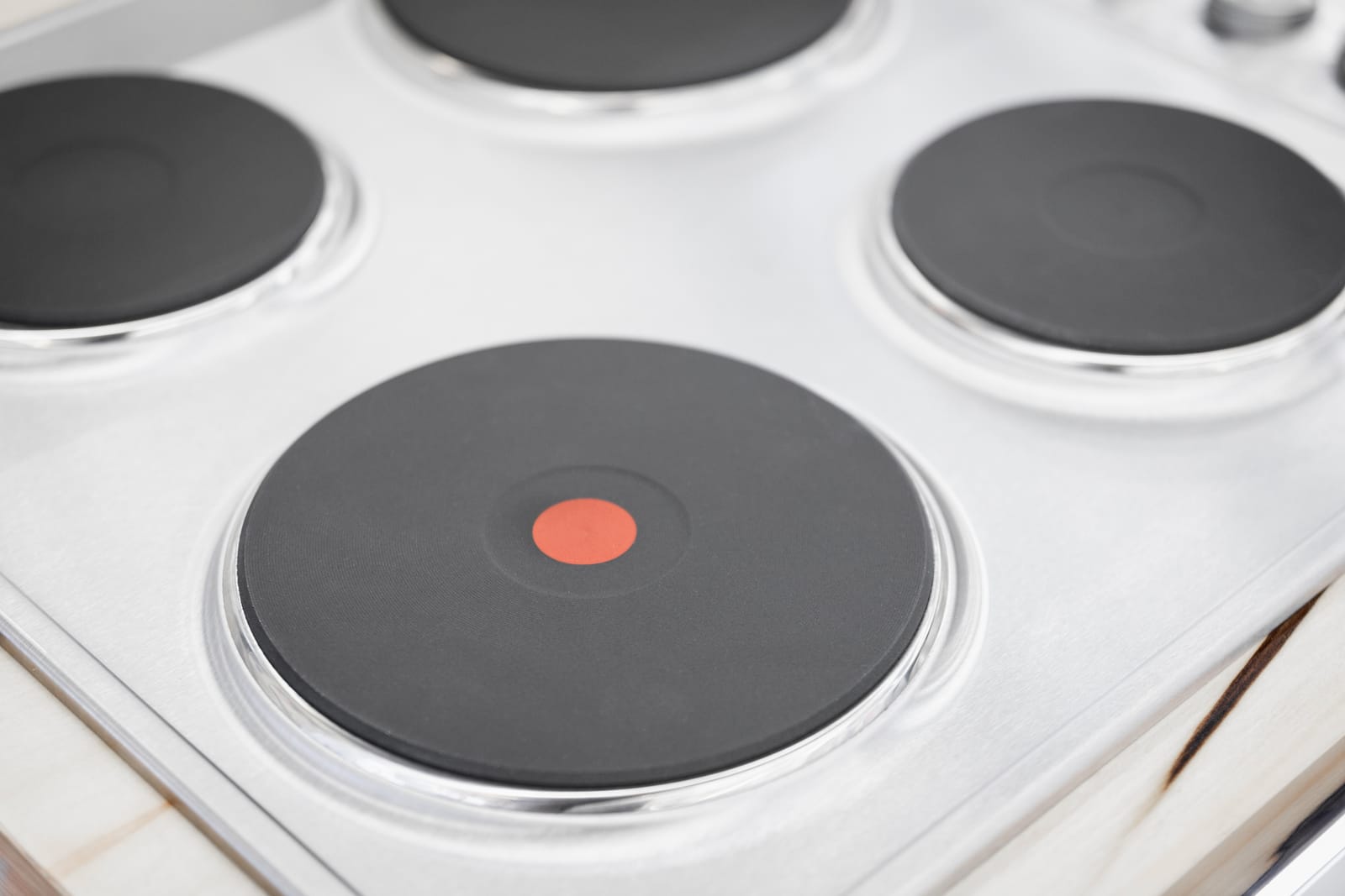 Professional Electric Stove Repair and Diagnosis - Appliance Repair Men - Appliance Repair Men - Appliance Repair Men A professional engineer diagnosing a faulty heating element on a white freestanding electric stove in a modern kitchen.