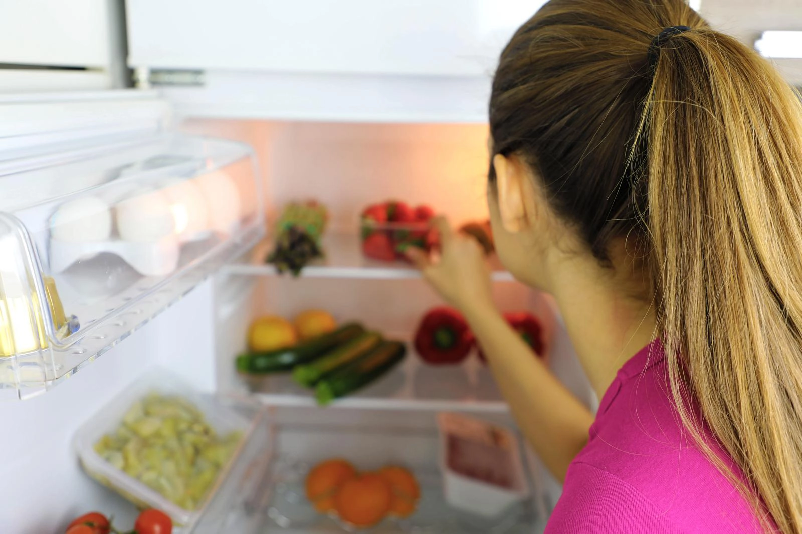 A well-ordered kitchen refrigerator demonstrating the correct way of organising your fridge for food safety.