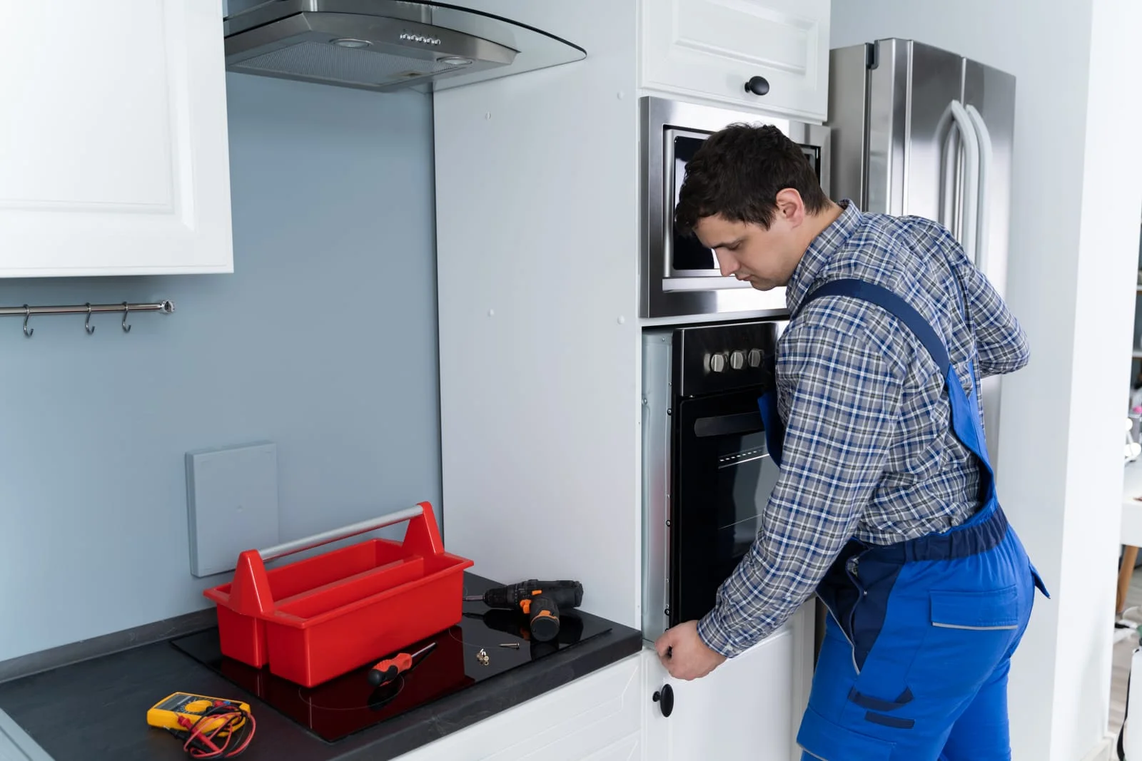 Electric Cooker Maintenance and Cooker Door Seal Repair Guide - Appliance Repair Men - Appliance Repair Men Routine Electric Cooker Maintenance being performed, including an inspection for a Cooker Door Seal Repair to Prolong Appliance Life