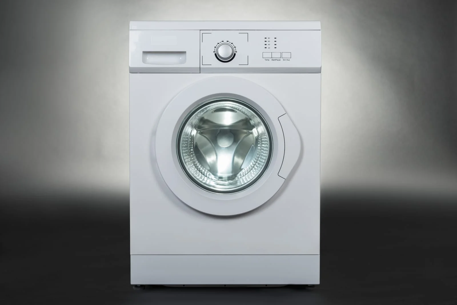 Washing Machine Not Draining and Pump Repair Service - Appliance Repair Men - Appliance Repair Men A technician investigating a Washing Machine Not Draining by checking for a Blocked Washing Machine Pump during a professional repair