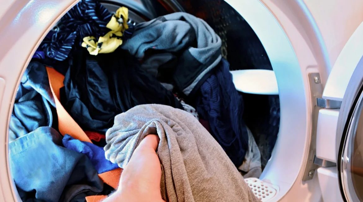 Tumble Dryer No Power and the Faults Behind a Completely Dead Machine - Appliance Repair Men Engineer checking the door switch during a tumble dryer no power repair in an Aughton garage utility area